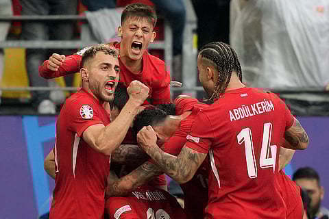 Mert Muldur celebrates after scoring Turkey's opening goal